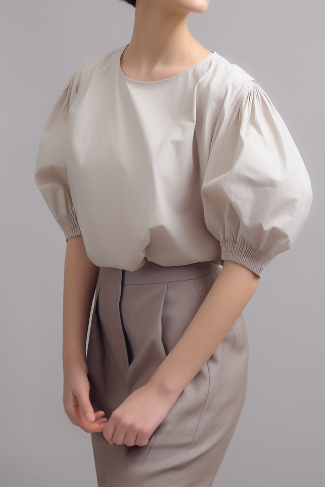 Koraalkleurige katoenen blouse met volumemouwen